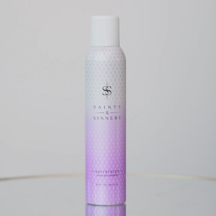 Superfresh divine dry shampoo being picked up, sprayed through hari, then hair being worked through with hands and flipped